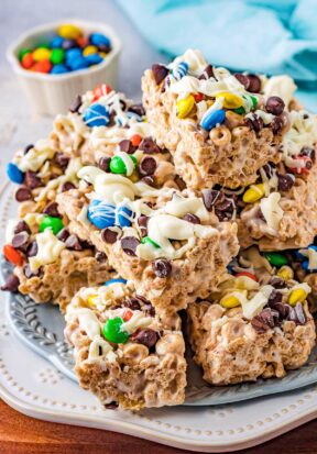 Prepared cereal bars stacked on a plate.